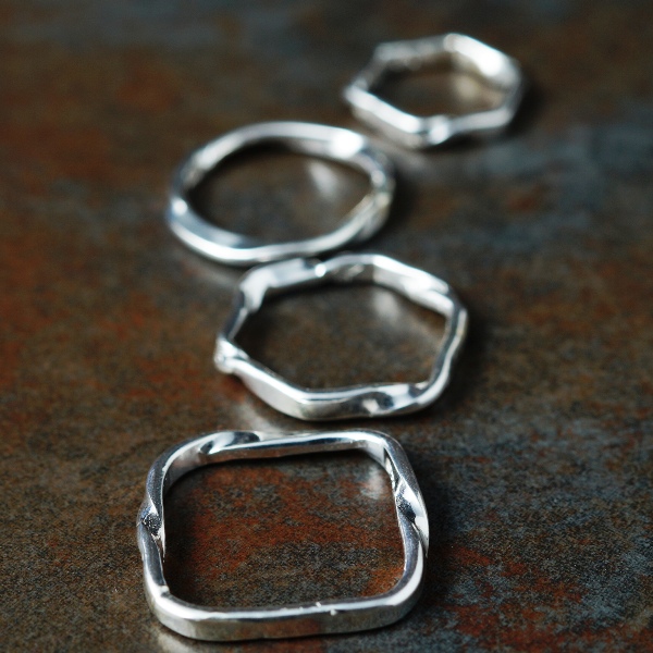 Handcrafted recycled sterling silver flow rings, stackable with attitude