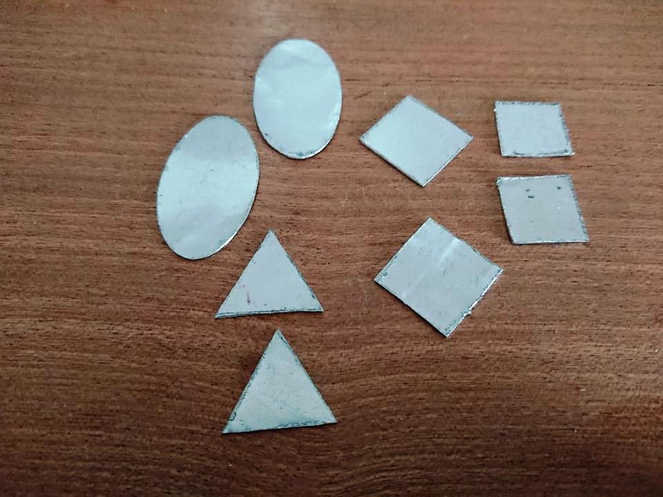 Hand sawn aluminium shapes for jewellery