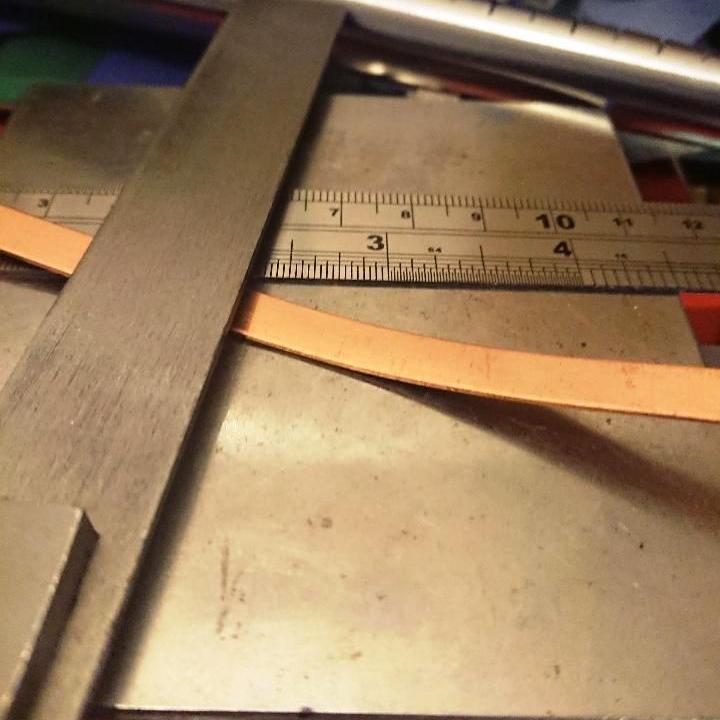 Assortment of metalsmithing tools needed for making rings, and copper bezel strip