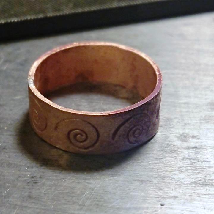 Handmade spiral stamped copper stamped ring after pickle