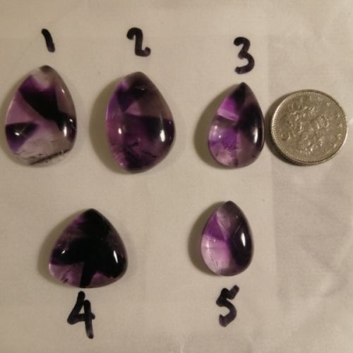 Selection of Tripache Amethyst cabochons for the commission ring