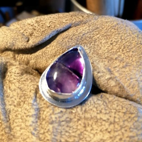 Commission handcrafted fine and sterling silver bezel ring setting and its tripache amethyst stone