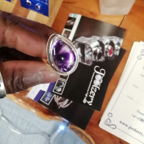 Commission handcrafted fine and sterling silver bezel ring setting and its tripache amethyst stone