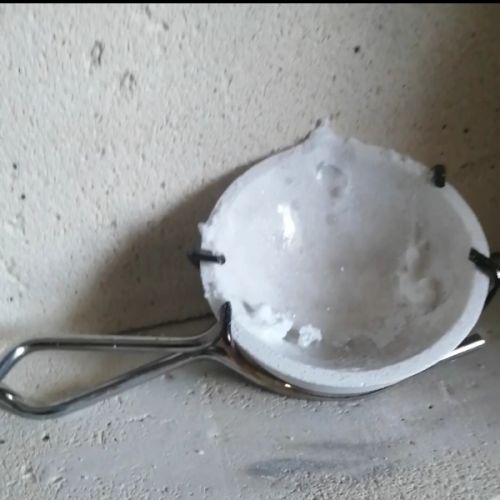 Seasoning the crucilbe with borax powder ready for melting scrap sterling silver