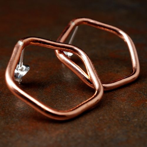 Handcrafted pentagonal recycled copper wire studs with sterling silver earposts and scrolls