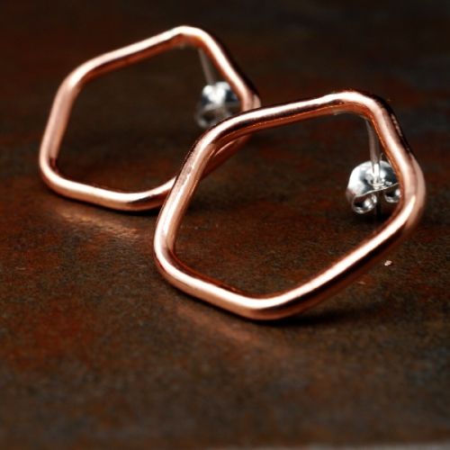 Handcrafted pentagonal recycled copper wire studs with sterling silver earposts and scrolls