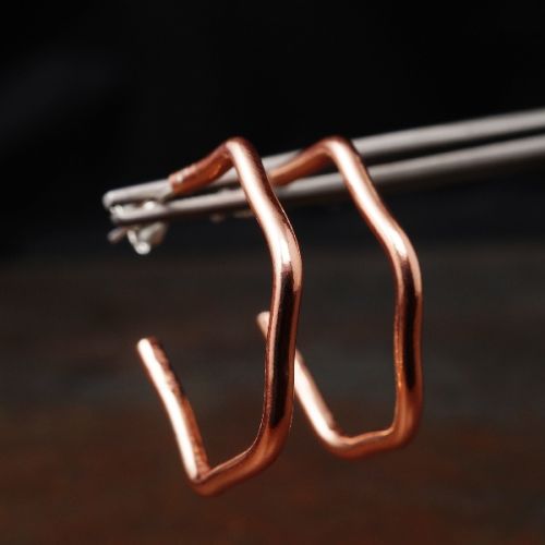 Handcrafted minimalist contemporary hexagonal flow hoops with sterling silver earposts perfect for e