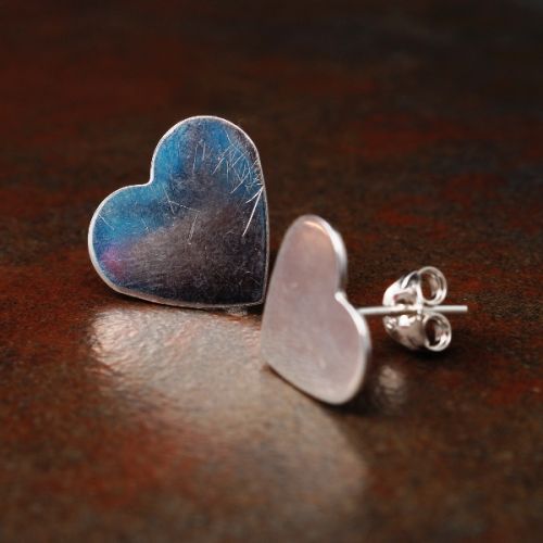 Handcrafted recycled sterling silver asymmetric  heart studs with sterling silver earposts and backs