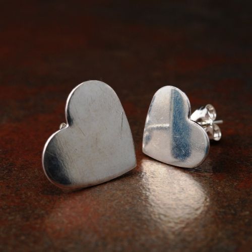 Handcrafted recycled sterling silver asymmetric  heart studs with sterling silver earposts and backs