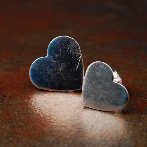 Handcrafted recycled sterling silver asymmetric  heart studs with sterling silver earposts and backs