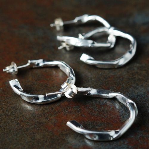 Handcrafted minimalist contemporary sterling silver flow hoops perfect for everday wear