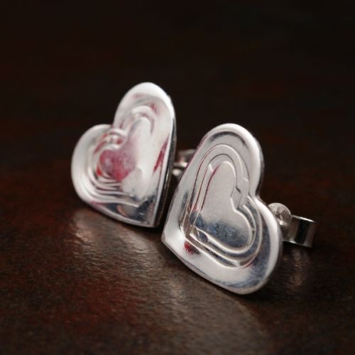Handcrafted recycled sterling silver stamped heart studs with sterling silver earposts and backs