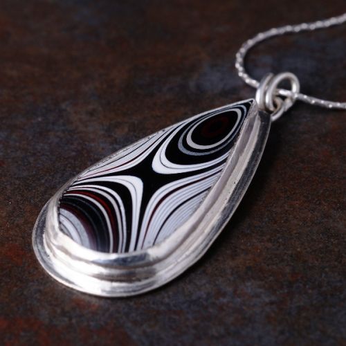 Handcrafted sterling silver teardrop Fordite  pendant 01