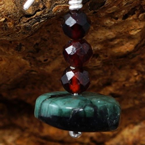 Handmade recycled sterling silver wire wrapped Garnet Natural Emerald earrings close up