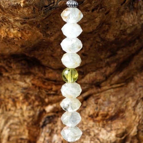 Handmade sterling silver faceted Peridot stacked London Blue Topaz Earrings close up