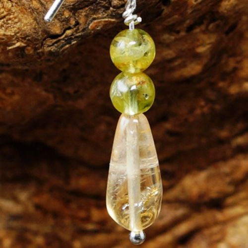 Handmade sterling silver wire wrapped Peridot Citrine earrings close up